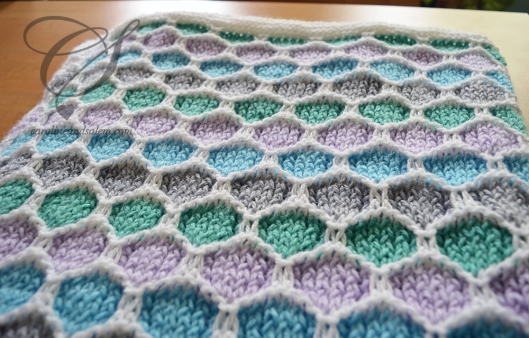 One closeup of the blanket and the honeycomb pattern.